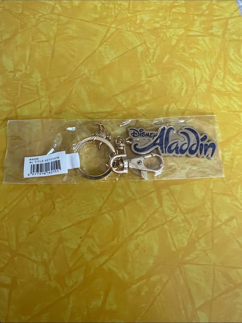 Disney Aladdin Logo Key Ring - Blue and Gold Hardware. Disney theatrical group.